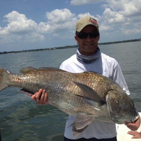 Person holding fish