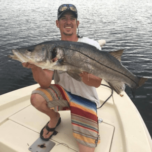 man holding large fish