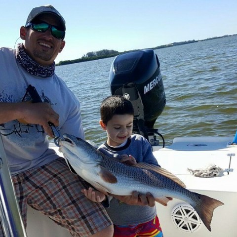 Person holding fish