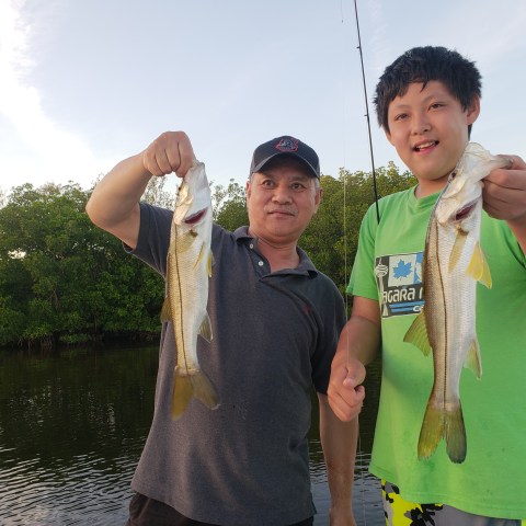 Person holding fish