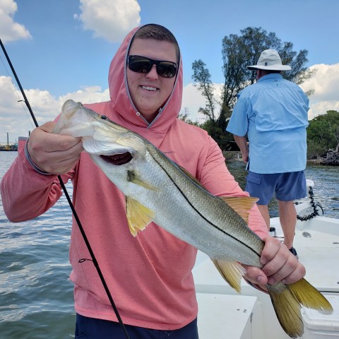 Person holding fish