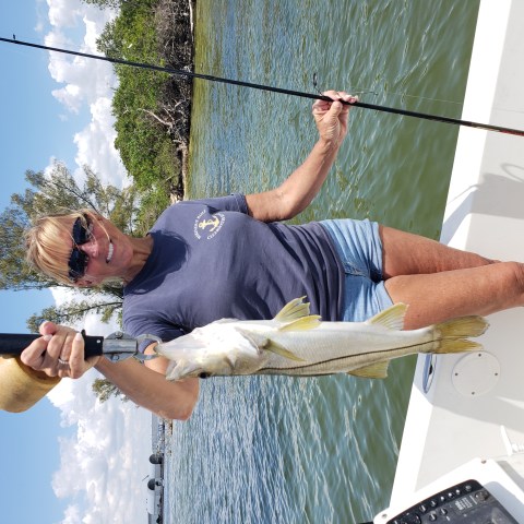 Person holding fish