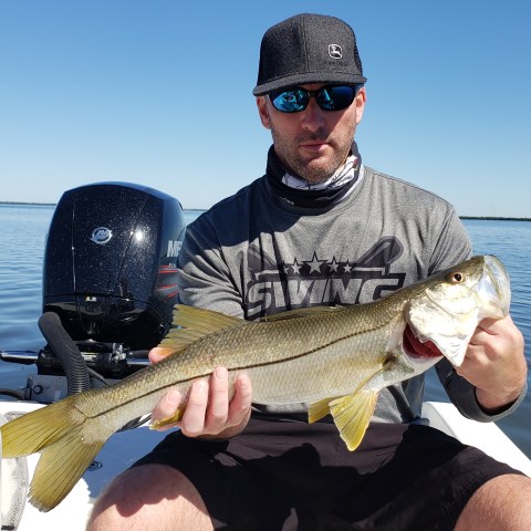Person holding fish