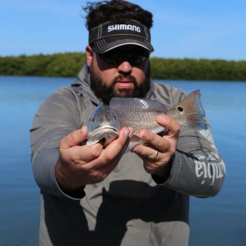 Person holding fish