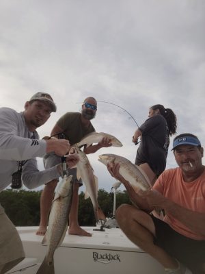 a man holding a fish